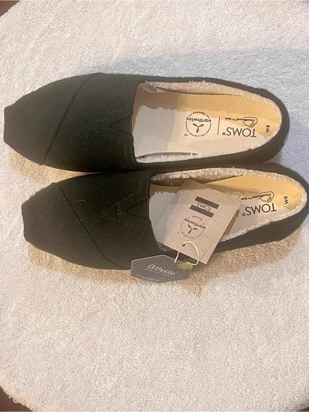 Toms Black Canvas Women's Slip-On Loafers with Sherpa Lining
